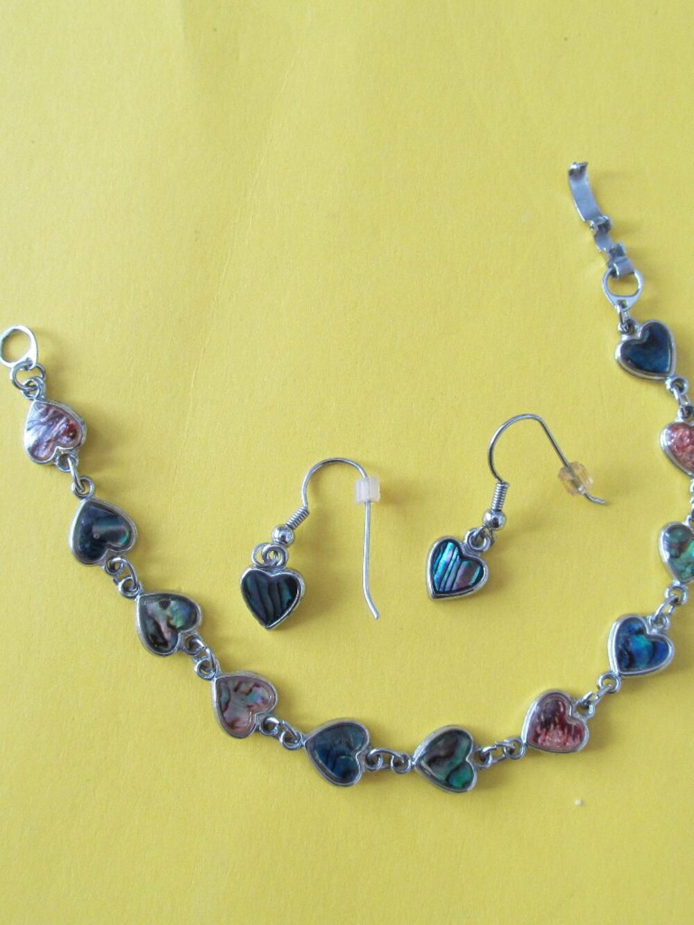 Heart shaped abalone shell bracelet and matching dangle earrings set.
